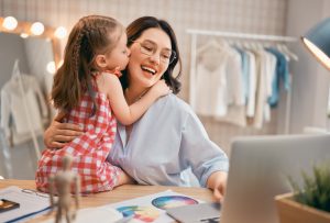 Woman is working at home workshop. Concept of small business. Mother and daughter.